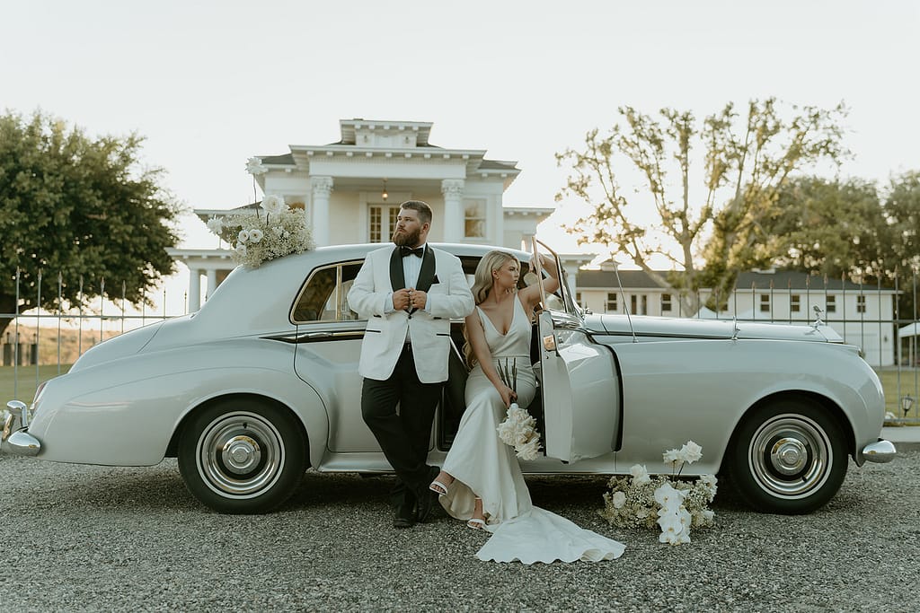Vintage car prop enhances the Old Hollywood aesthetic in post-wedding photos at Moore Mansion, showcasing classic charm.