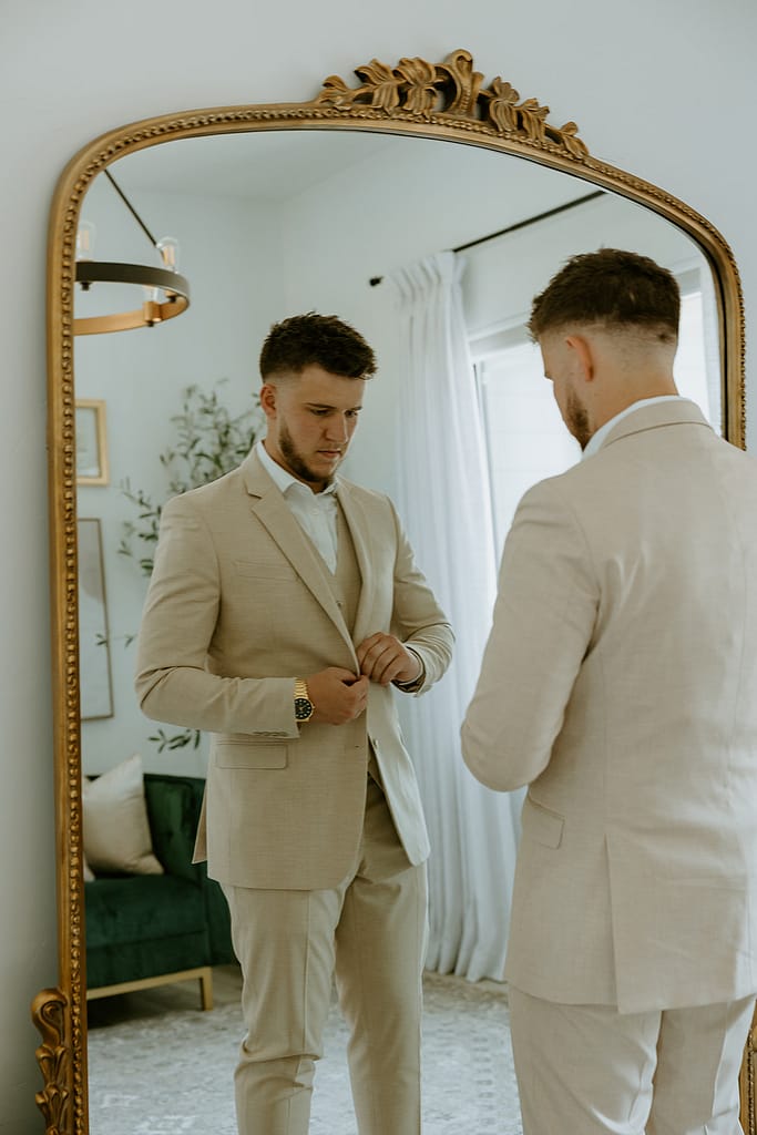 groom getting ready before ceremony 