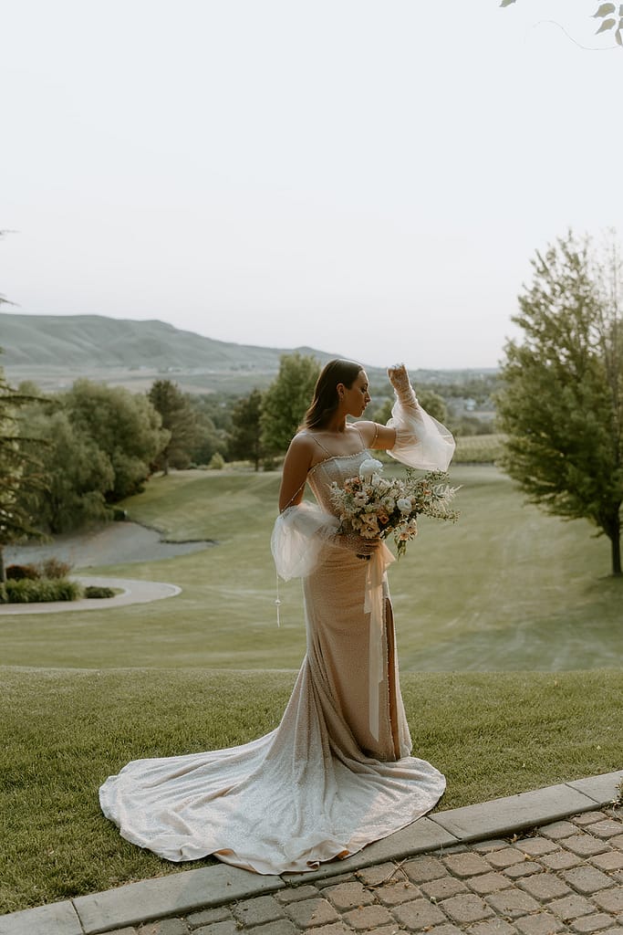 bride wearing a puff sleeve wedding dress with pearl detailing