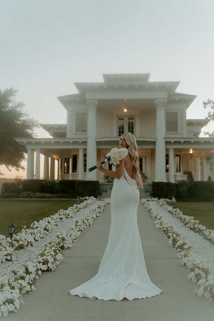 Elegant bride in a silk gown, showcasing Old Hollywood style at Moore Mansion in a timeless post-wedding photoshoot.