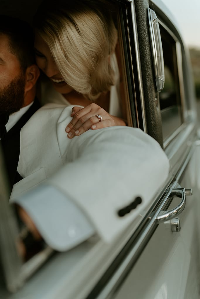 documentary style bride and groom in a vintage car