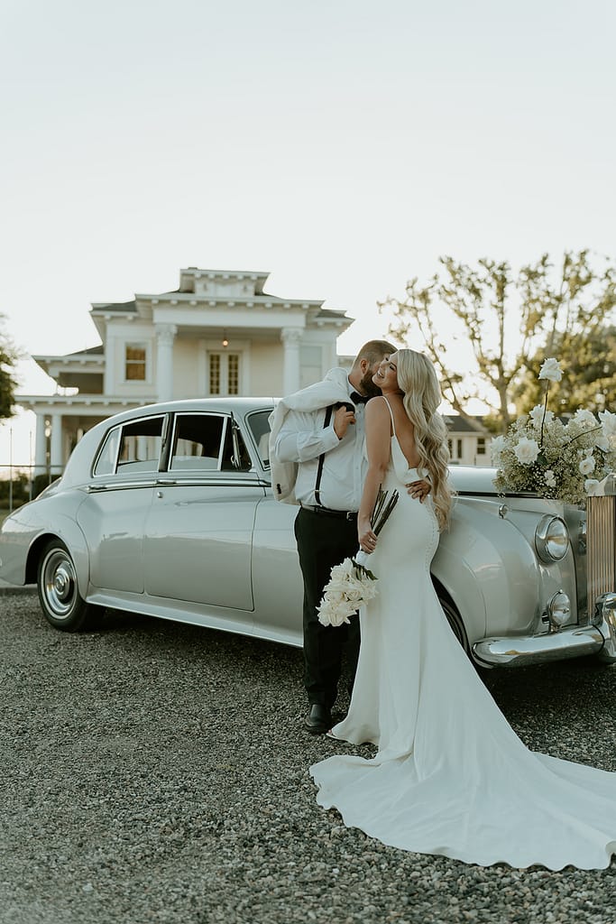 Vintage car prop enhances the Old Hollywood aesthetic in post-wedding photos at Moore Mansion, showcasing classic charm.