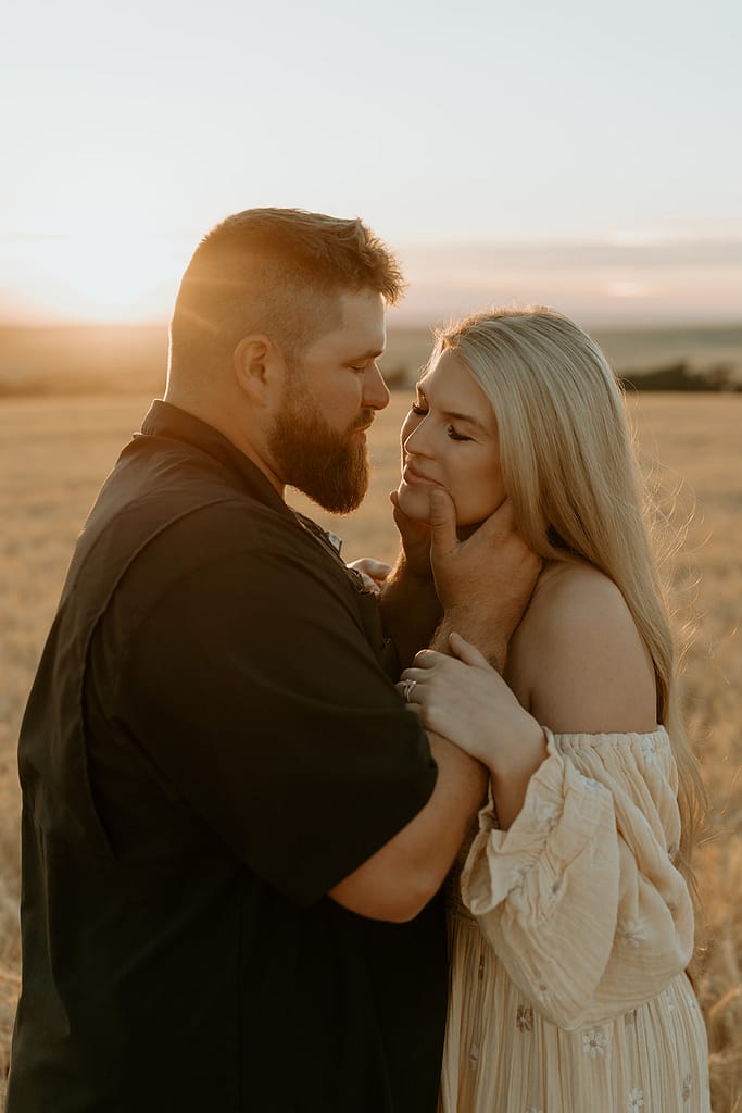 Haley and Tate share a tender moment, the setting sun creating a romantic backdrop for their pregnancy reveal photo shoot.
